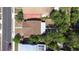 Top down aerial view of a house surrounded by greenery at 910 E Chelsea St, Tampa, FL 33603