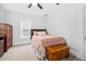 Bright bedroom with a wooden bed frame, a wood chest, and a beige color scheme at 910 E Chelsea St, Tampa, FL 33603