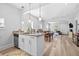 Open-concept kitchen with breakfast bar, granite countertops and stainless steel dishwasher at 910 E Chelsea St, Tampa, FL 33603