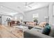 Bright living room features light hardwood floors, a large couch, and a modern design at 910 E Chelsea St, Tampa, FL 33603