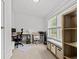 Bright office with multiple desks, chairs, and ample natural light from large windows at 910 E Chelsea St, Tampa, FL 33603