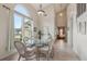 Bright dining area with cathedral ceilings and large window at 9322 Via Segovia, New Port Richey, FL 34655