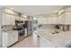 Bright kitchen features stainless steel appliances, and plenty of counter space at 9322 Via Segovia, New Port Richey, FL 34655