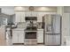 Updated kitchen includes stainless steel appliances and plenty of white cabinets at 9322 Via Segovia, New Port Richey, FL 34655