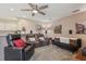 Living room with comfortable seating, modern decor, and views into the kitchen at 9322 Via Segovia, New Port Richey, FL 34655
