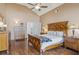Spacious main bedroom with hardwood floors, high ceilings, and access to an ensuite bathroom at 9322 Via Segovia, New Port Richey, FL 34655