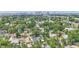 Aerial view of a neighborhood with tree-lined streets, showcasing the property's location in a vibrant community at 1006 E 23Rd Ave, Tampa, FL 33605