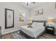 Calm bedroom offers a queen bed, soft rug, decor, and natural light at 1006 E 23Rd Ave, Tampa, FL 33605