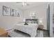 Inviting bedroom with a cozy queen-sized bed, decorative art, and relaxing ambiance at 1006 E 23Rd Ave, Tampa, FL 33605