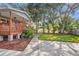 The backyard showcases well-manicured landscaping, including green grass and defined planting areas with mulch at 1045 28Th S Ave, St Petersburg, FL 33705