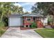 Charming single-story home with a cozy front porch and well-maintained landscaping at 1045 28Th S Ave, St Petersburg, FL 33705