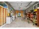 Spacious garage with ample storage, workbench, and outside access, ready for projects and organization at 1045 28Th S Ave, St Petersburg, FL 33705