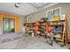Spacious garage featuring shelving and a workbench area, ideal for storage and DIY projects at 1045 28Th S Ave, St Petersburg, FL 33705