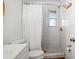 A bright bathroom featuring a shower with white subway tiles, a shower curtain, and modern fixtures at 1045 28Th S Ave, St Petersburg, FL 33705