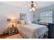 Charming bedroom with natural light, ceiling fan, and coastal decor at 10930 Marjory Ave, Tampa, FL 33612