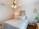 Bedroom featuring ample sunlight, a ceiling fan and a comfortable bed at 10930 Marjory Ave, Tampa, FL 33612