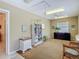 Bedroom with carpet floor, two windows, storage shelves, good lighting and a calming atmosphere at 10930 Marjory Ave, Tampa, FL 33612