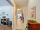 Inviting hallway with tile flooring leading to a spacious living area, showcasing an open and airy design at 10930 Marjory Ave, Tampa, FL 33612