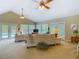 Bright living room with vaulted ceiling, two sofas, and access to the pool area through French doors at 10930 Marjory Ave, Tampa, FL 33612