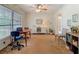 Bright office space with a large window, ceiling fan, and neutral carpeting at 10930 Marjory Ave, Tampa, FL 33612