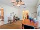 Bright office space with a large window, neutral carpet, and ceiling fan at 10930 Marjory Ave, Tampa, FL 33612
