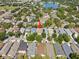 Aerial view of a neighborhood with mature trees, highlighting the home's location at 11363 Cocoa Beach Dr, Riverview, FL 33569