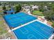 A vivid view of the community's basketball and tennis courts with playground and pond nearby at 11363 Cocoa Beach Dr, Riverview, FL 33569