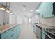 Modern kitchen design featuring a kitchen island, and stainless steel appliances at 11363 Cocoa Beach Dr, Riverview, FL 33569