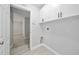 Well-lit laundry room showcasing white cabinets and plenty of space at 11363 Cocoa Beach Dr, Riverview, FL 33569
