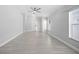 A spacious, neutral living room with an open floor plan and lots of natural light at 11363 Cocoa Beach Dr, Riverview, FL 33569