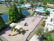 Aerial view of the community playground and recreational facilities, with lake in the distance at 11363 Cocoa Beach Dr, Riverview, FL 33569