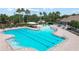 Bright community pool with a water slide and shaded seating at 11363 Cocoa Beach Dr, Riverview, FL 33569
