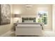 Cozy bedroom with soft lighting, neutral tones, decorative chandelier, and well-coordinated decor at 114 Leisure Pl, Rotonda West, FL 33947