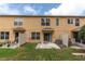 Spacious backyard featuring a patio, privacy fence, and well-manicured lawn, perfect for outdoor enjoyment at 11615 Mango Ridge Blvd # 39, Seffner, FL 33584