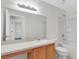 Bathroom featuring a large mirror, vanity, and tub with shower combo at 11615 Mango Ridge Blvd # 39, Seffner, FL 33584