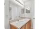 Bathroom with double sinks, a large mirror, and natural lighting at 11615 Mango Ridge Blvd # 39, Seffner, FL 33584