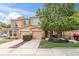 Charming townhome showcases a well-maintained lawn, lovely tree, and inviting facade at 11615 Mango Ridge Blvd # 39, Seffner, FL 33584