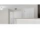 Hallway leading to rooms with tiled floors and neutral wall colors at 11615 Mango Ridge Blvd # 39, Seffner, FL 33584
