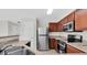 Well-equipped kitchen features stainless appliances, and generous counter space at 11615 Mango Ridge Blvd # 39, Seffner, FL 33584