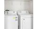 Bright laundry area featuring a white washer and dryer set for added convenience at 11615 Mango Ridge Blvd # 39, Seffner, FL 33584