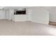 Open-concept living room with tile flooring, natural light, and staircase access at 11615 Mango Ridge Blvd # 39, Seffner, FL 33584