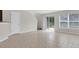 Bright living room featuring tile flooring and sliding glass doors to the backyard at 11615 Mango Ridge Blvd # 39, Seffner, FL 33584