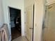 View from bathroom showing linen closet, walk-in closet, and tiled shower at 12032 Grand Kempston Dr, Gibsonton, FL 33534