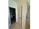 View from bathroom showing linen closet, walk-in closet, and tiled shower at 12032 Grand Kempston Dr, Gibsonton, FL 33534