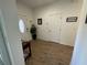 Foyer with tiled flooring, glass accented front door and a decorative plant at 12032 Grand Kempston Dr, Gibsonton, FL 33534
