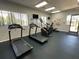 An exercise room features two treadmills and an elliptical machine at 12032 Grand Kempston Dr, Gibsonton, FL 33534