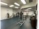 An exercise room features weights and weight machines at 12032 Grand Kempston Dr, Gibsonton, FL 33534