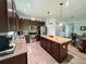 Spacious kitchen with granite counters, stainless appliances, and a large island at 12032 Grand Kempston Dr, Gibsonton, FL 33534