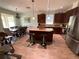 Open concept kitchen with an island and eat-in dining area that is great for entertaining at 12032 Grand Kempston Dr, Gibsonton, FL 33534