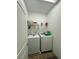 Laundry room features white washer and dryer at 12032 Grand Kempston Dr, Gibsonton, FL 33534